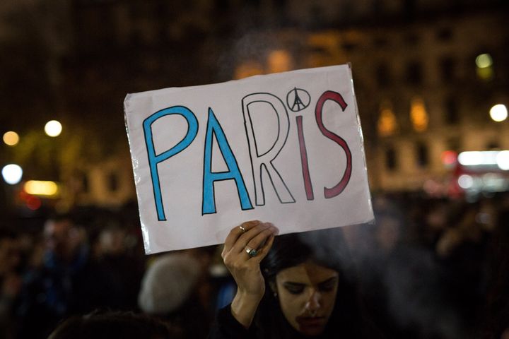 As people at vigils around the world, such as this one in London, remembered Paris on Saturday, Syrians in Paris looked for ways to help in their new home.