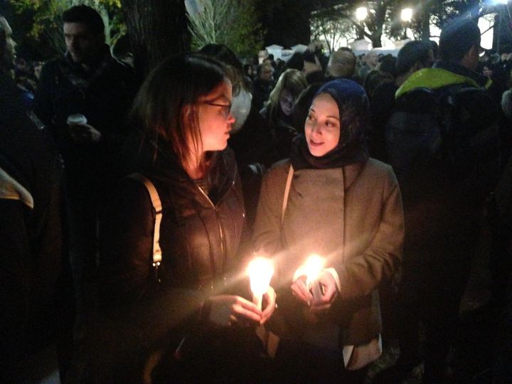 Emma Barnes, left, and Marwa Ibrahim, right, attended the vigil outside the White House on Saturday afternoon.