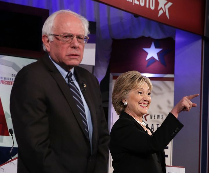 Democratic presidential candidates Sen. Bernie Sanders (I-Vt.) and Hillary Clinton stand on the stage prior to the presidential debate. Sanders still doesn't want to hear any more about the emails.