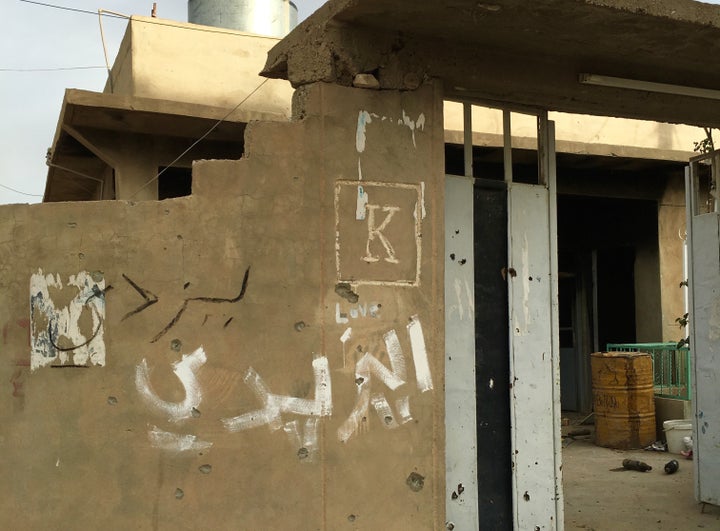 "Yazidi" written in Arab on the exterior of a family home in Sinjar, Iraq.&nbsp;