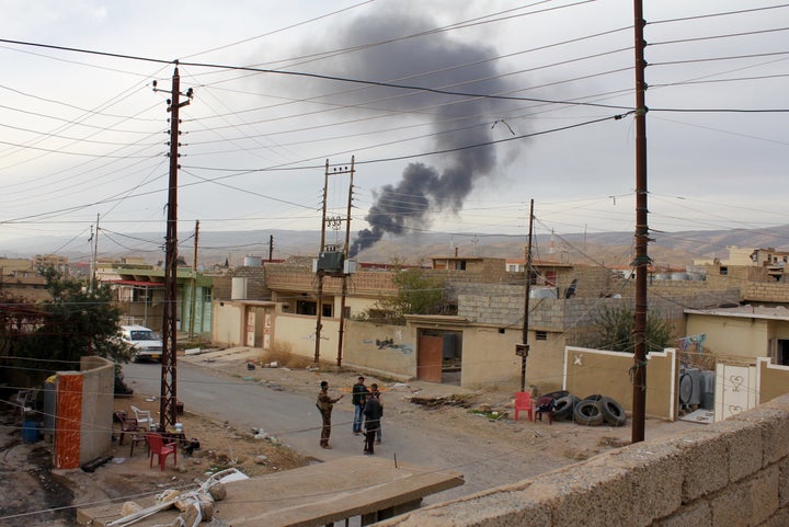 Plumes of smoke rising above Sinjar, reportedly from Yazidi fighters burning the homes of former Sunni inhabitants out of revenge. 