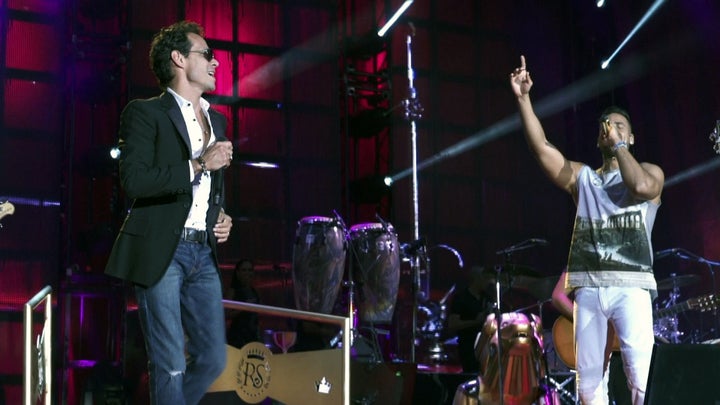 Salsa singer Marc Anthony performing with Bachata artist Romeo Santos. Their performance was included in the HBO documentary, "The Latin Explosion: A New America."