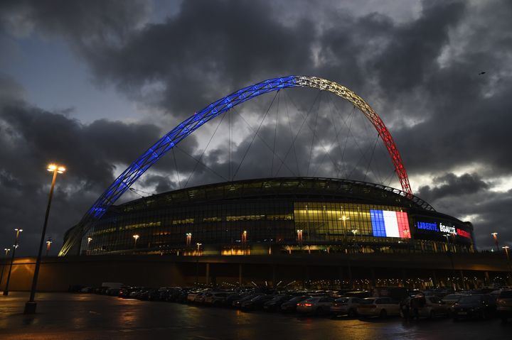 The Wembley Stadium arch is lit up with the colours of the French flag before the International Friendly match between England and France.