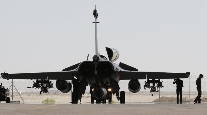 France stepped up airstrikes against the Islamic State, striking its bases in Raqqa.