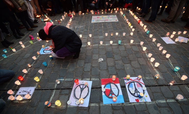 Hundreds of people flocked to the Molenbeek area in Brussels, Belgium, to honor the lives lost in Paris with a candlelight vigil Wednesday. Two suspected assailants of the Paris attacks lived in the neighborhood.