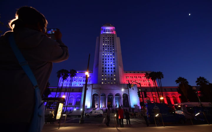 The Los Angeles City Hall is lit with the colors of the French flag on November 17, 2015 as Mayor Eric Garcetti was join