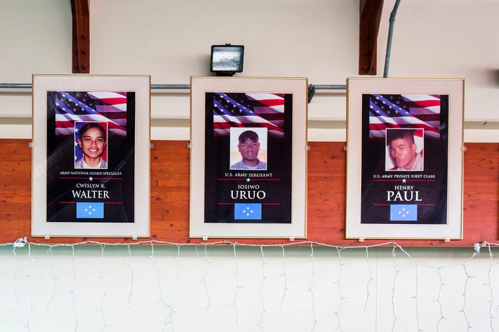 Portraits of fallen Micronesian soldiers hang at the airport on Pohnpei. Both U.S. island territories as well as U.S.-affiliated Micronesian island nations have high per capita rates of deaths in the military.