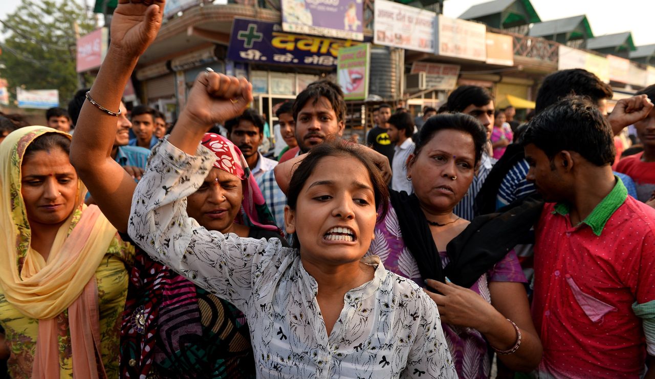 Indian protesters shout slogans near the home of a minor girl who was raped in New Delhi on Oct. 17, 2015.