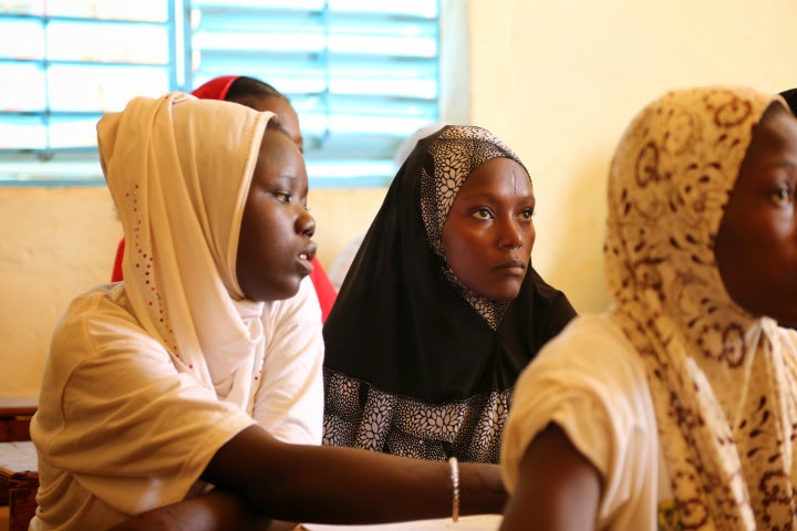 Fati grew up only conversing in Hausa, the language of the largest ethnic group in West Africa.. She's learning to sound out the words in her 10-year-old nephew Abdoul's French textbooks.