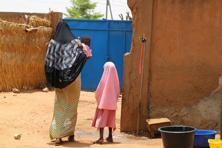 When Fati's nephew, Abdoul, attends a French-speaking school several streets away, Fati has begun conducting makeshift lessons for herself and her young female relatives inside her family's compound.