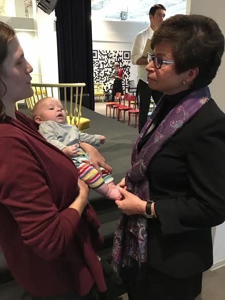 Jarrett, right, speaks with Alison Gilles, who's out on leave now at Spotify -- she'd holding her 10 week old son.