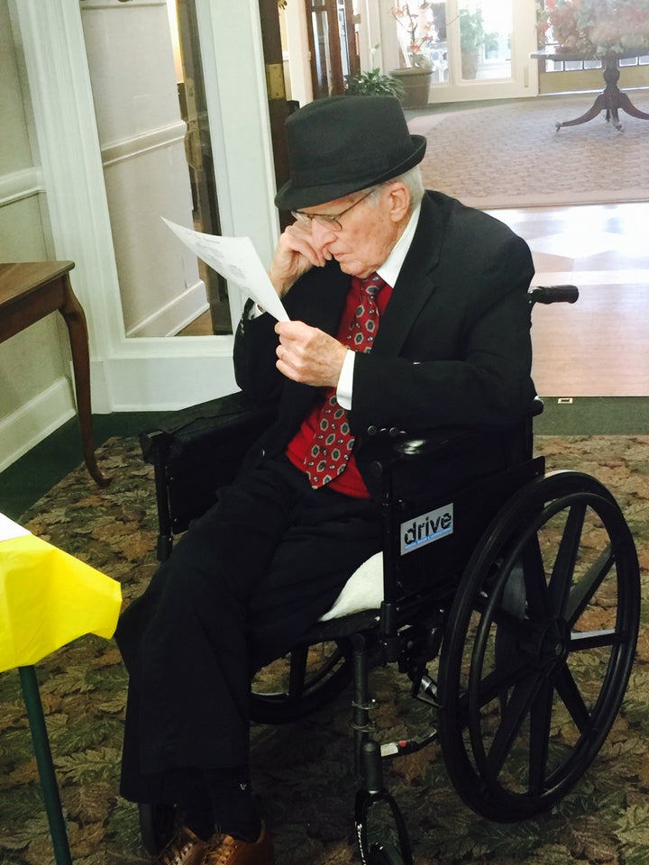 Allan Little viewing an old picture of himself. 