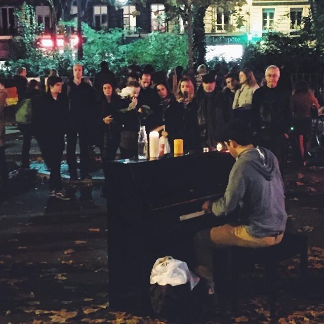 A man plays piano outside Bataclan on Nov. 18, 2015 in Paris.
