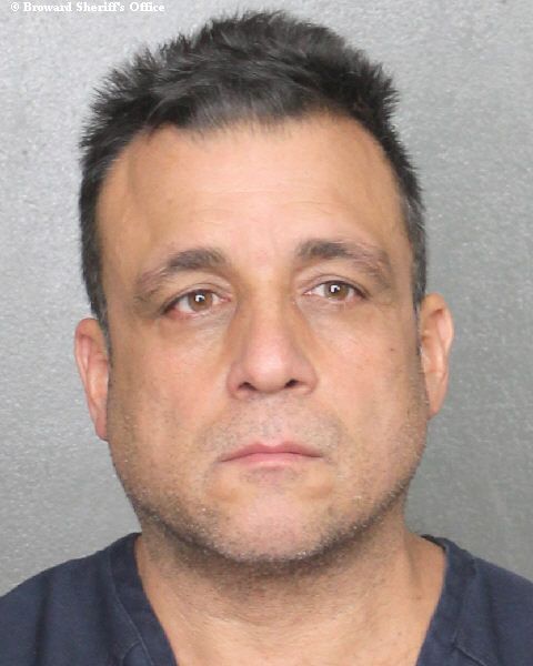 Andres Zamora, 51, is accused of selling drugs and stolen guns from his south Florida home while also illegally cashing in on disability payments.