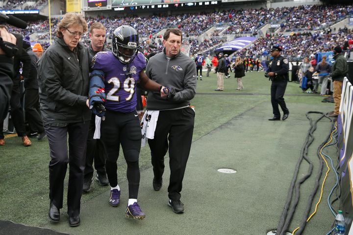 Running back Justin Forsett #29 of the Baltimore Ravens is helped off of the field after an injury in the first quarter against the St. Louis Rams at M&T Bank Stadium on November 22, 2015 in Baltimore, Maryland.