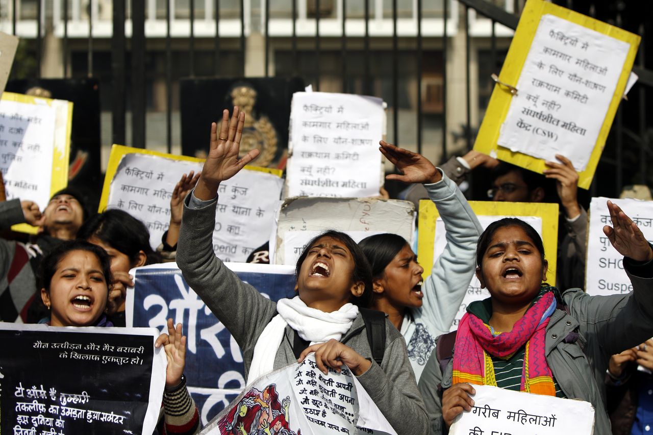 Protesters shout slogans during a demonstration outside police headquarters in New Delhi on January 13, 2015. The protesters were demonstrating against alleged police negligence in the murder and gang rape of a local woman.