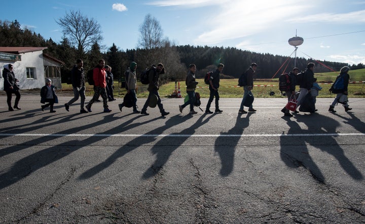 Refugees cross the Austrian-German border in Wegscheid, Germany, on Nov. 18, 2015. Reuters reported in Oct. that roughly 10,000 refugees and asylum seekers arrive in the country every day.