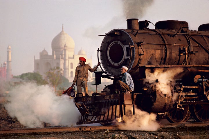 Steam engine passes in front of the Taj Mahal, Agra, Uttar Pradesh; 1983.