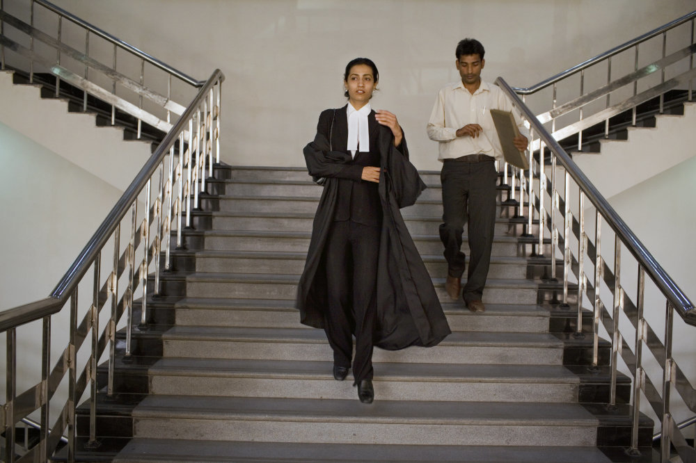 Why do lawyers in India have black coat as their dress code? What's the  logic behind it? - Quora