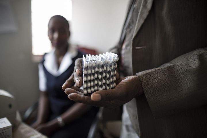 An Hiv positive patient is given a month worth of medication at the Thyolo District hospital during a routine antiretroviral consultation on November 26, 2014. The World Health Organization (WHO) says there were some 35 million people around the world living with HIV by the end of 2013, with some 2.1 million new infections during the course of that year. Sub-Saharan Africa is the most affected region, with almost 70 percent of new infections.
