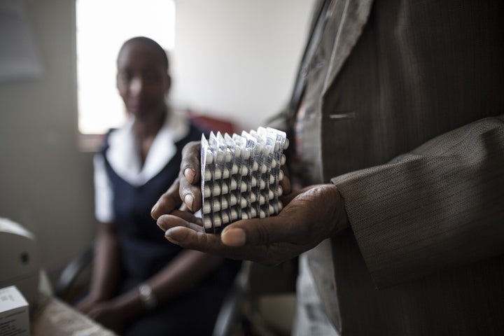 An Hiv positive patient is given a month worth of medication at the Thyolo District hospital during a routine antiretroviral