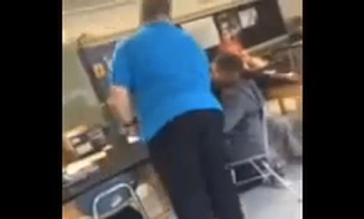 The former middle school teacher claims he resorted to grabbing the student's chair and yanking it when the boy repeatedly refused to move.