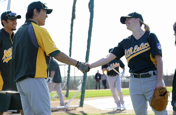 Justine Siegal shook hands with former Oakland A's player Hideki Matsui before she threw batting practice to the team in 2011. This fall, the A's made Siegal the first woman to coach for a MLB team.