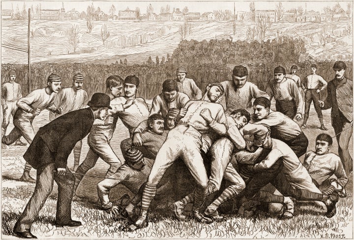 Wood engraving from Harper's Weekly magazine depicts on-field action during a football game between Yale and Princeton on Thanksgiving Day, November 1879.