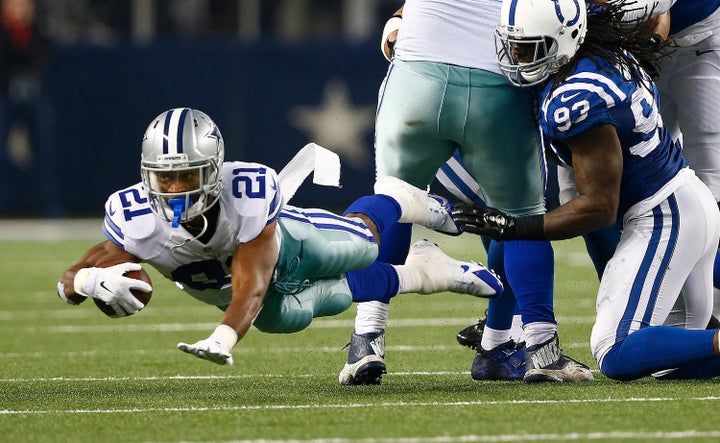 Randle leaps for third-quarter yardage against the Indianapolis Colts' Erik Walden on Sunday, Dec. 21, 2014, at AT&T Stadium in Arlington, Texas.