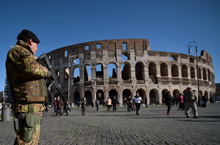 A soldier patrols near the Colosseum on Wednesday. Italian Prime Minister Matteo Renzi said in his security budget announcement that $530 million would be earmarked for the Italian armed forces.