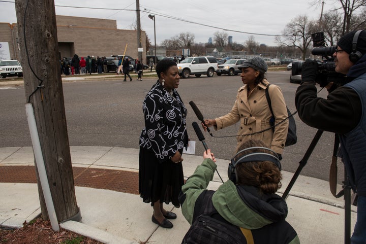 Arnetta Phillips, Director of Community Outreach Services at Shiloh Temple, speaks with media members outside the funeral ser