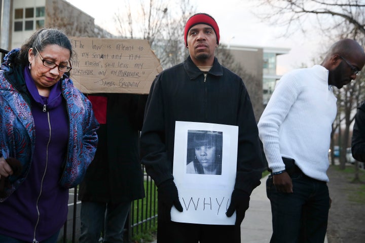 Donald Lightfoot holds a sign in support of Rekia Boyd while joining other protesters in Chicago on Monday, Apr. 20, 2015.