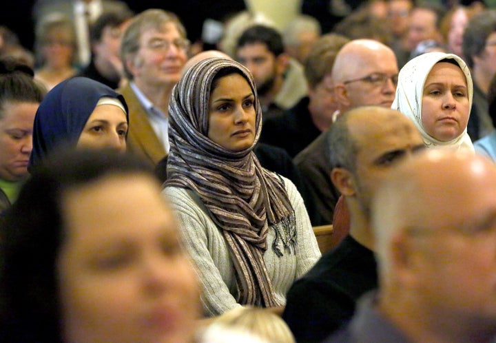 A woman looks on during a welcome event for refugees in an Allentown, PA church.