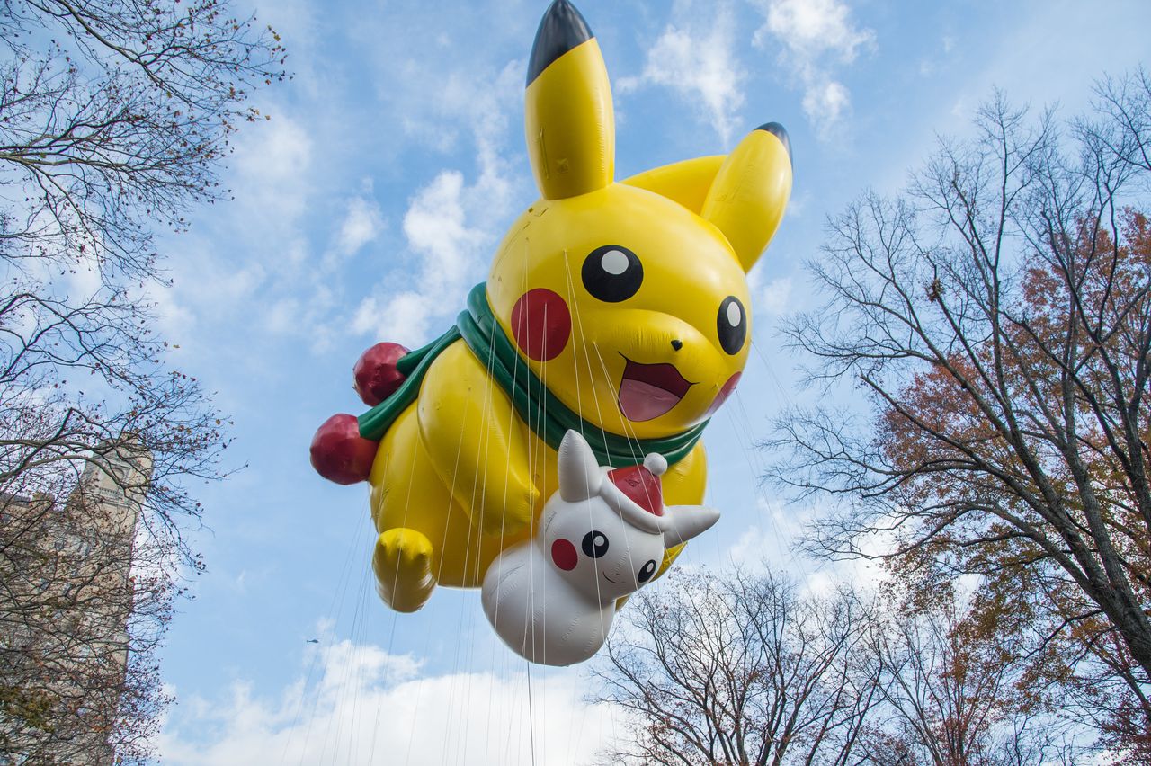 Pikachu makes its way through the parade with a little buddy in tow. 