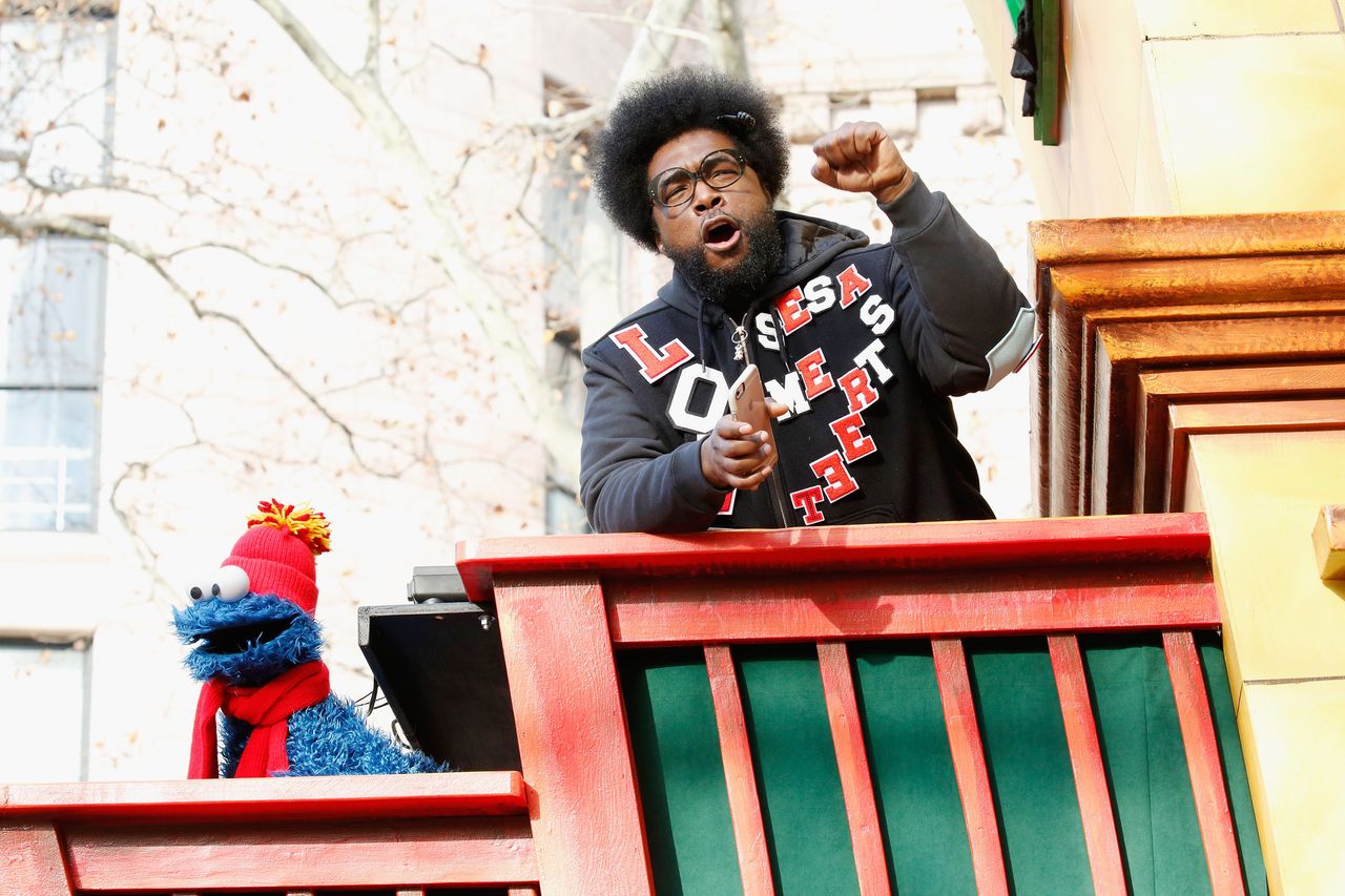 Drummer Questlove jams out on his float with Cookie Monster. 