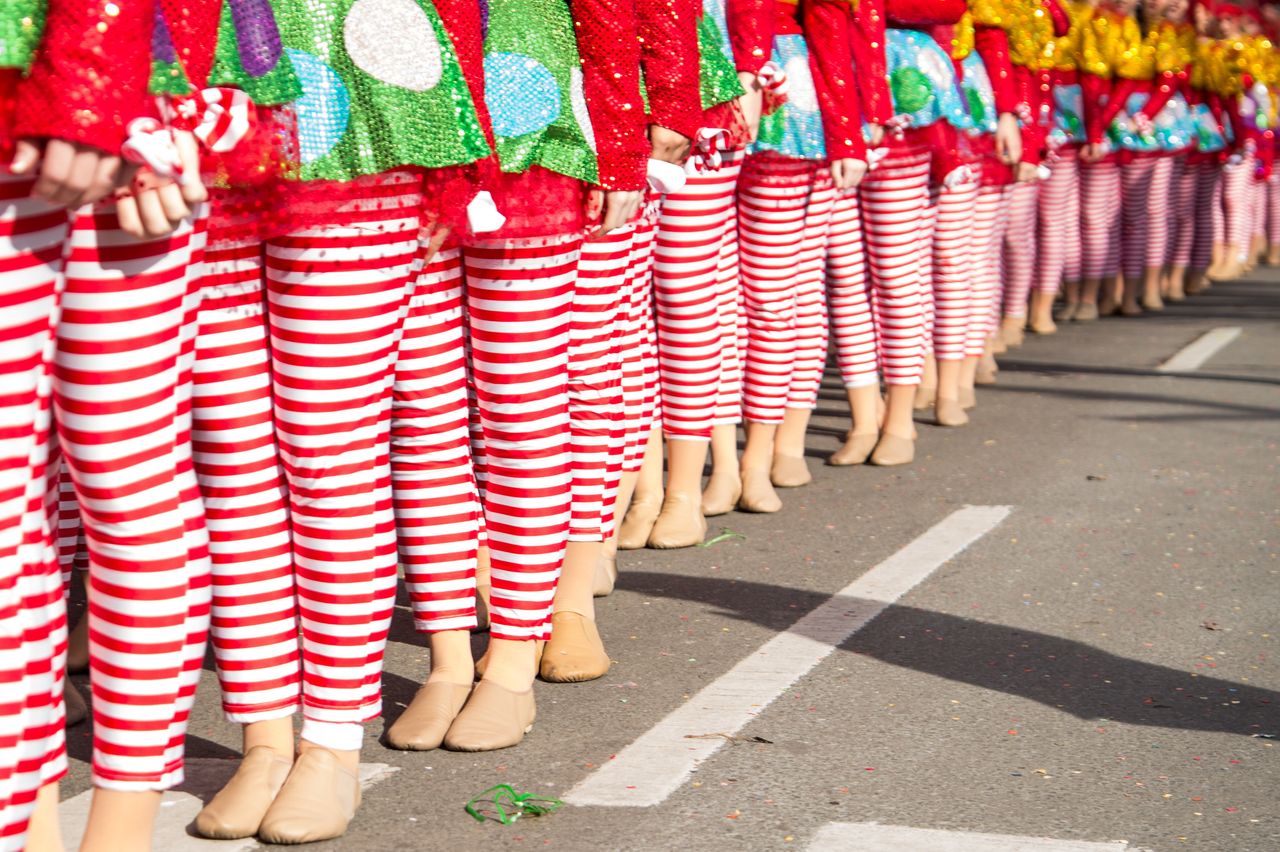 Candy cane-striped dancers line up for the parade. 