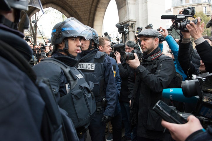 French police wade through hordes of international media hours after the siege on suspected terrorists in the Saint-Denis nei