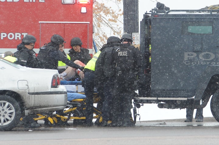 An unidentified victim is transported into an ambulance after a gunman opened fire at a Planned Parenthood facility in Colorado Springs, Colorado, on Friday. The attack was one of several against Planned Parenthood clinics this year.