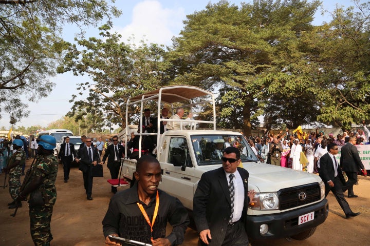 Pope Francis waves to faithful from a car during his visit to Central Mosque in Bangui, Central African Republic on November 30, 2015. 