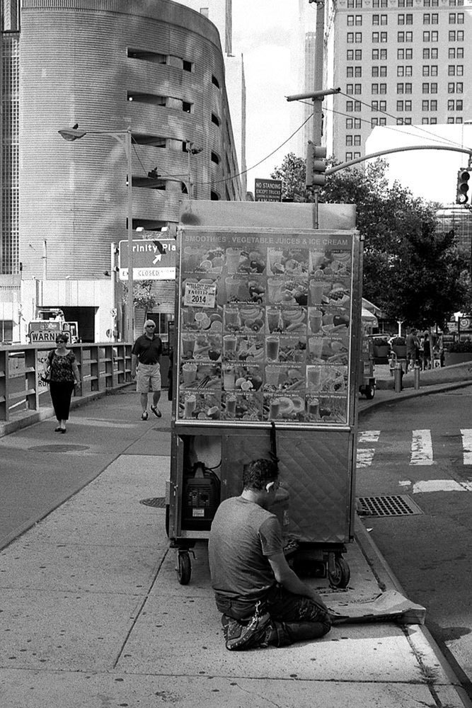 Man Praying Next to his Halal Cart, Lower Manhattan 2014