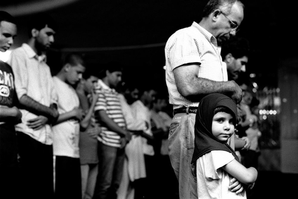Young Girl at Prayers with her Father, Muslim AmericanSociety, Brooklyn, NY 2010