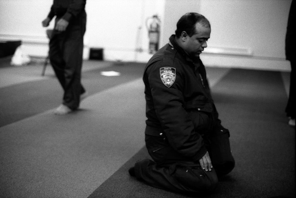 NYPD Traffic Officer at Prayer, Park 51, Manhattan, NY 2012