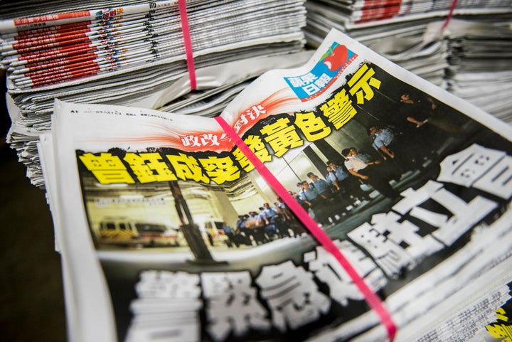 Copies of the Apple Daily newspaper sit stacked at the company's printing facility in Hong Kong.