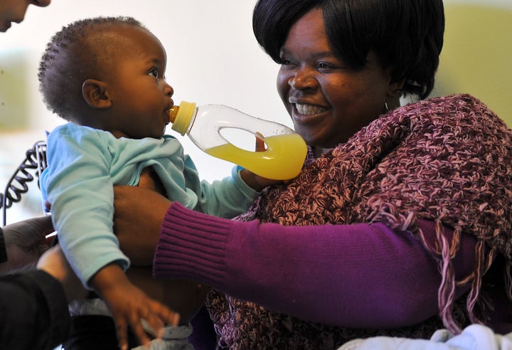 One-year-old Katakane is held on May 16, 2012 by her HIV-positive mother, Nandi, 32, at the Chris Hani Baragwanath Hospital, South Africa's largest public hospital, in Soweto. The little girl was born healthy thanks to treatment that has saved thousands of babies and her visit is only a routine check-up. Two years ago while she was expecting Nandi went through a state health programme that keeps HIV-positive mothers from infecting their babies with the virus. The treatment has saved up to 70,000 babies more every year -- a massive success story in a country with almost six million people living with HIV and AIDS and a notorious treatment history.