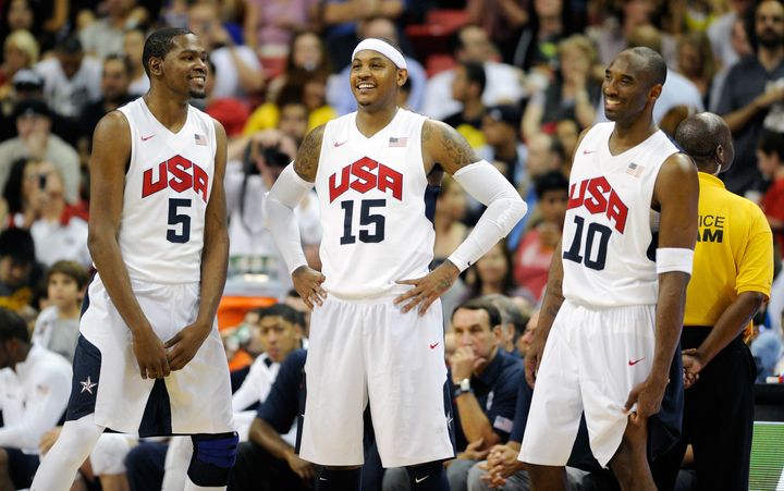 Durant, Bryant and Carmelo Anthony talk on the sideline during a pre-Olympic exhibition game against the Dominican Republic on July 12, 2012, in Las Vegas, Nevada. The United States won the game, 113-59.