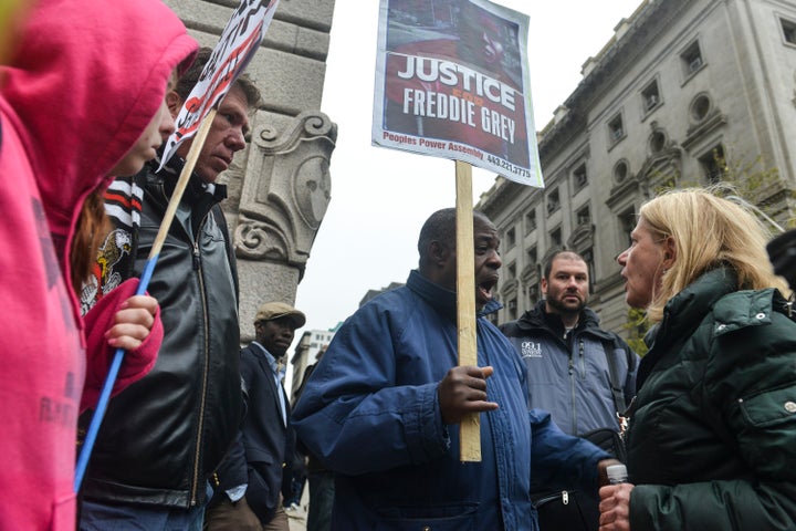 A handful of protesters gather outside the Baltimore Circuit Court on Nov. 30.