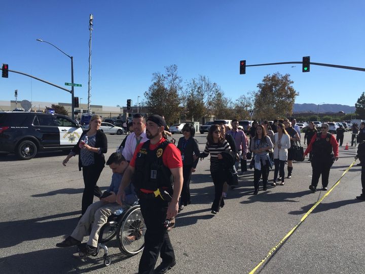 People are evacuated away from the shooting scene in San Bernardino, California, on Wednesday. 