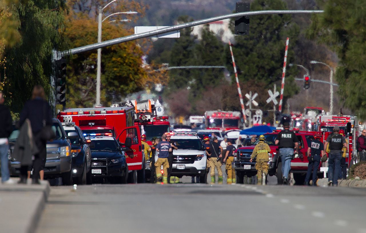 Police and fire personnel secure the scene in San Bernardino, California.