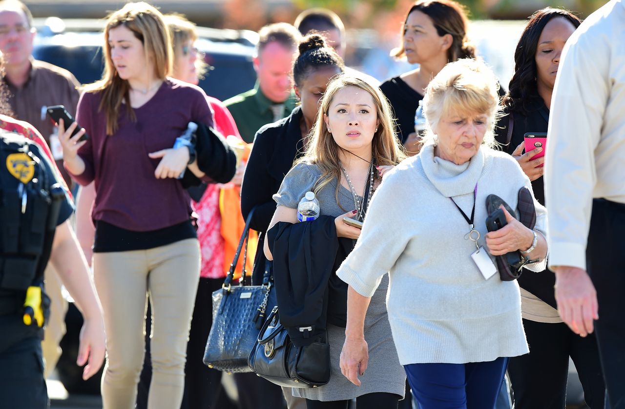 Survivors are evacuated from the scene of a shooting on Dec. 2, 2015, in San Bernardino, California.