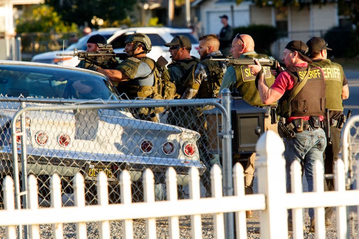 Law enforcement officers search for suspects following the mass shooting in San Bernardino on December 2, 2015. Two suspects were later killed in a shootout with police. 